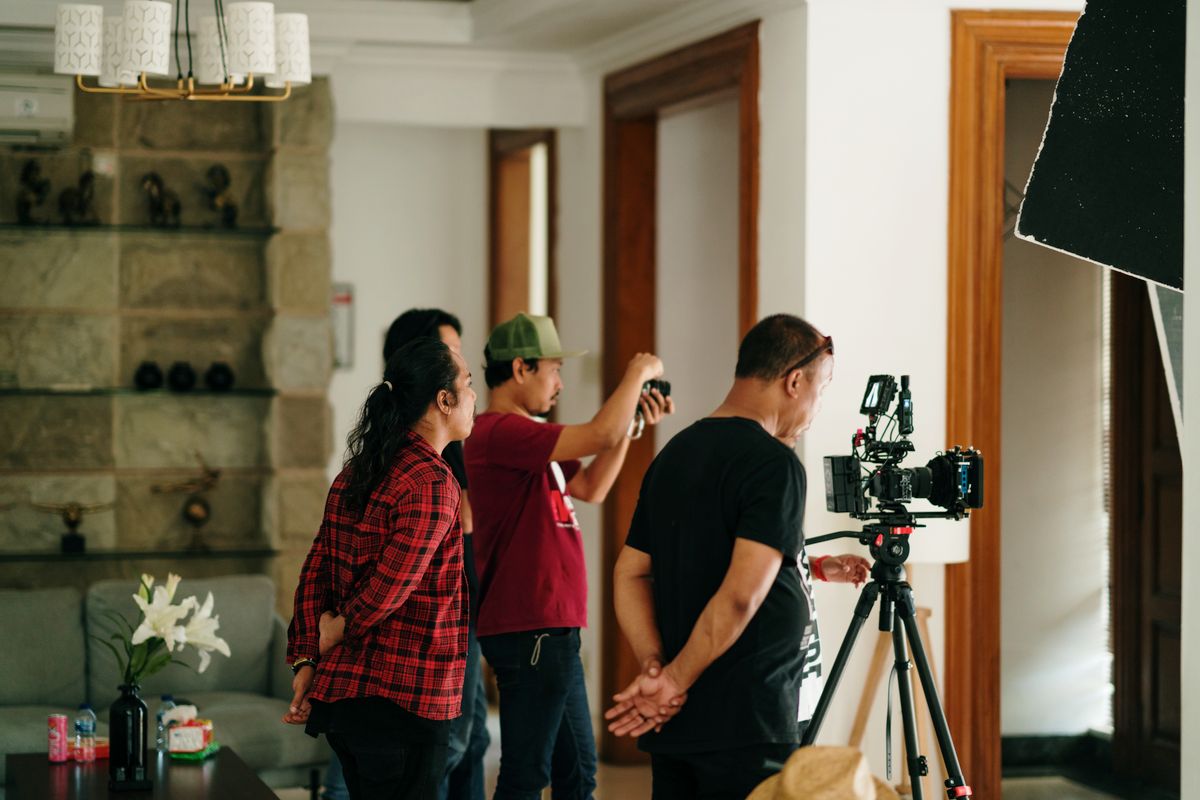 Videographer filming with a professional camera