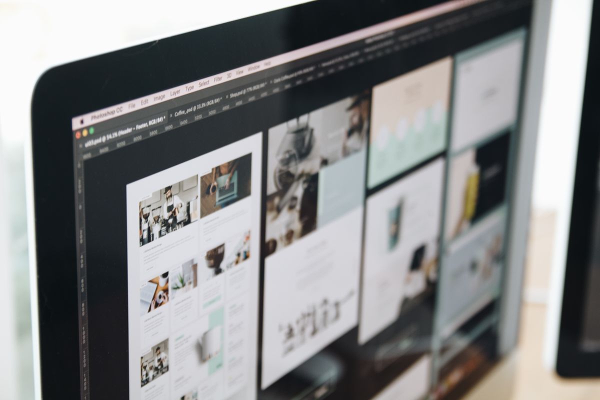 Website design wireframes shown on a laptop