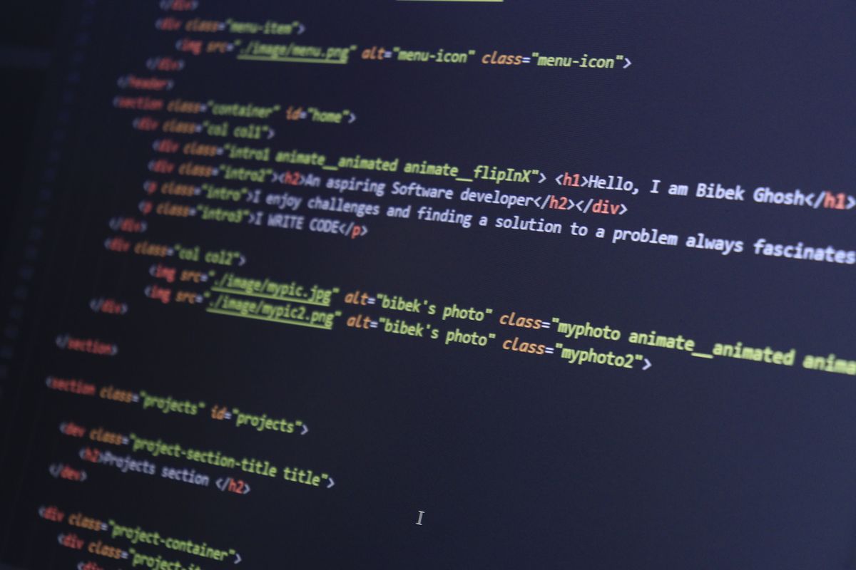 Developer building a responsive website on a laptop